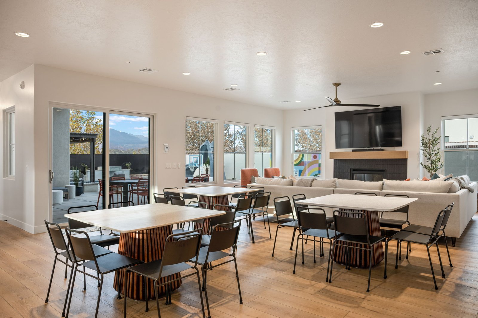 Great room at Color House with four dining tables that seat 35 together