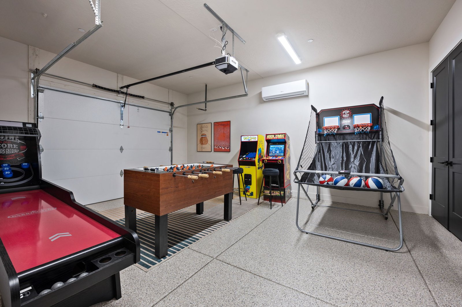 Game garage at Color House with skee-ball, foosball, arcade cabinets and pop-a-shot